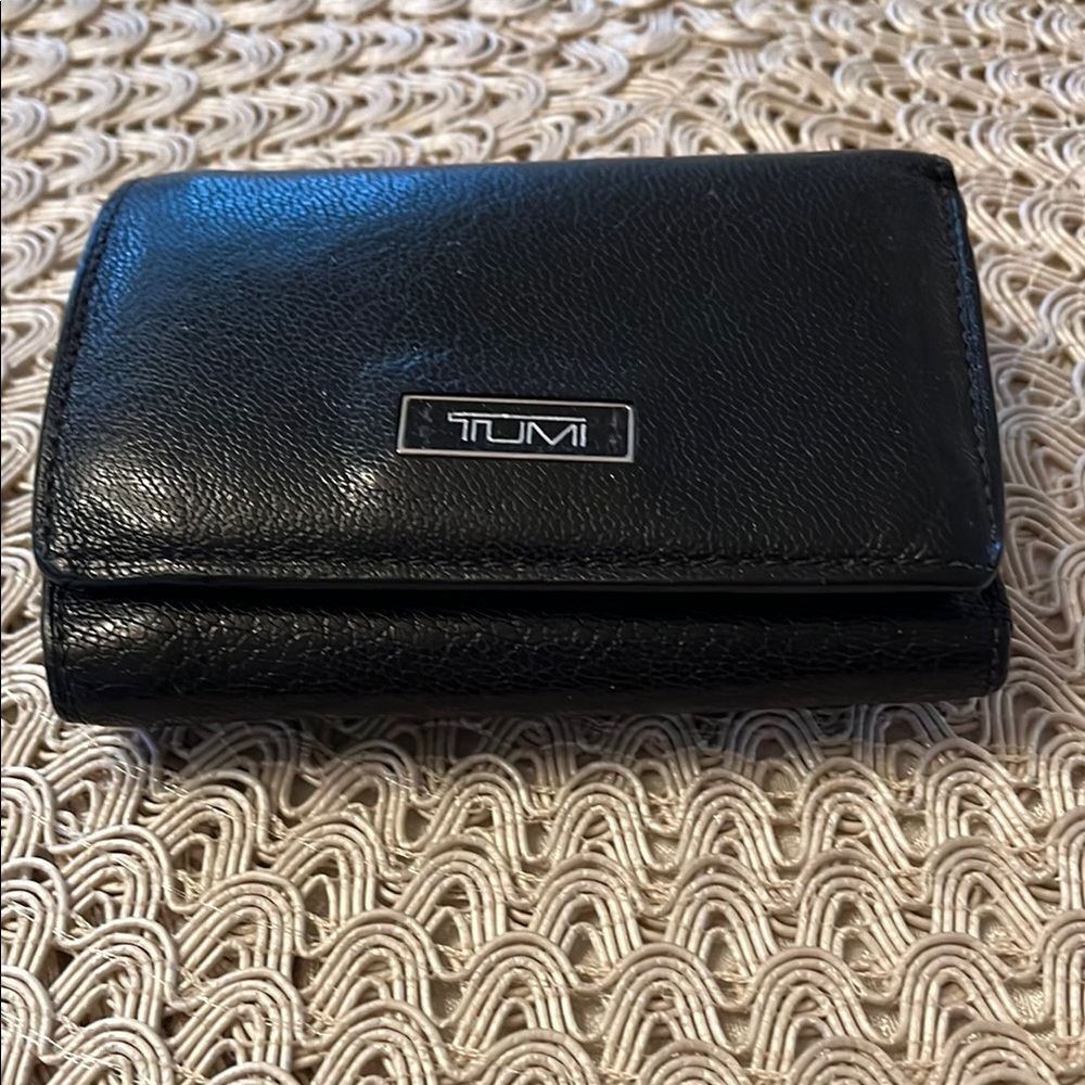 TUMI Black Leather Wallet in EUC. (Plastic Credit Card cover ripped)